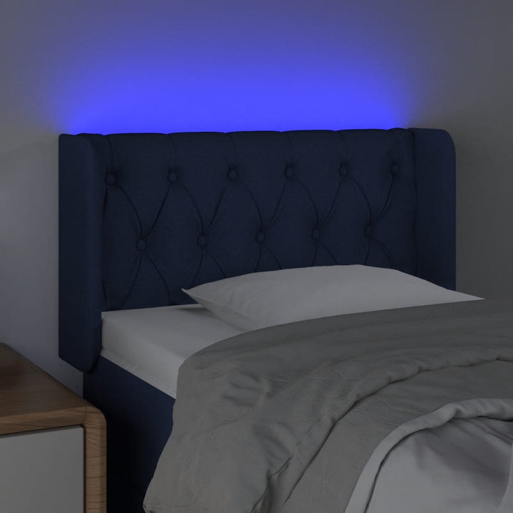 sengegavl med LED-lys 83x16x78/88 cm stof blå