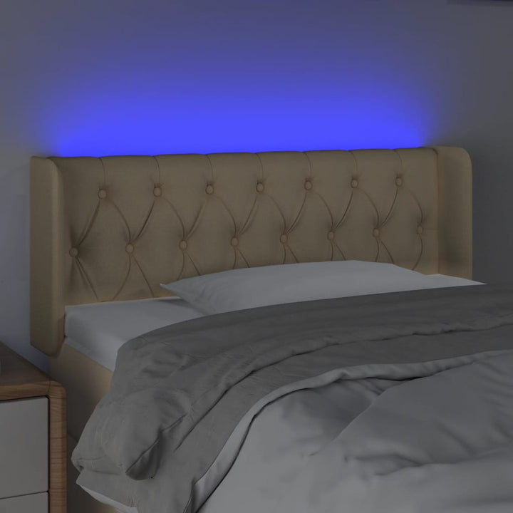 sengegavl med LED-lys 93x16x78/88 cm stof cremefarvet
