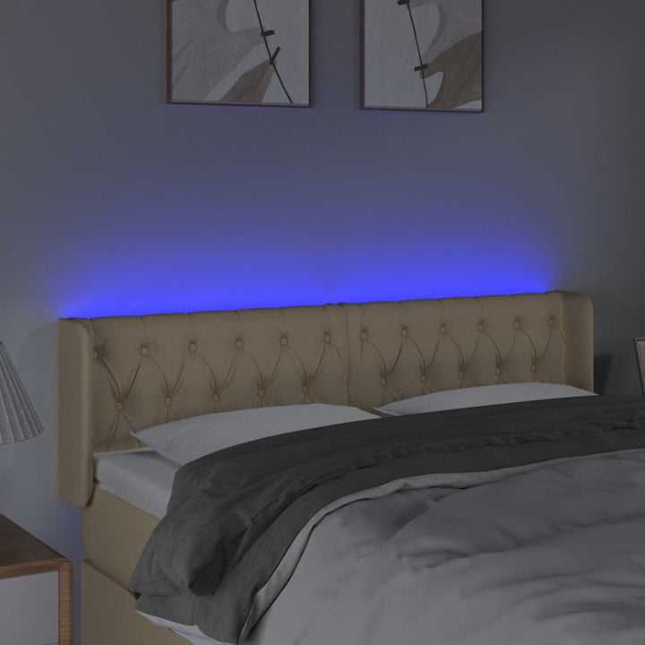 sengegavl med LED-lys 163x16x78/88 cm stof cremefarvet