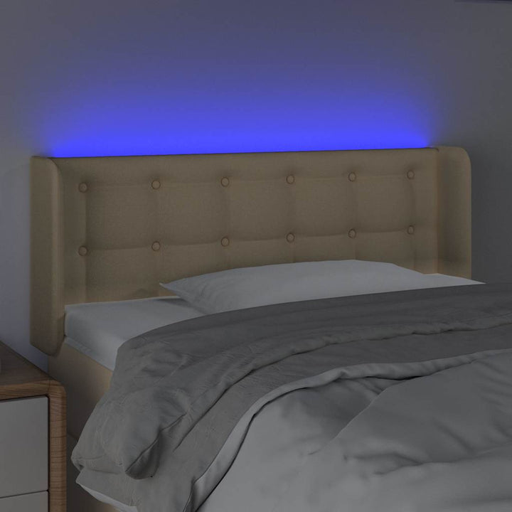 sengegavl med LED-lys 83x16x78/88 cm stof cremefarvet