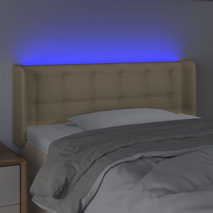 sengegavl med LED-lys 83x16x78/88 cm stof cremefarvet