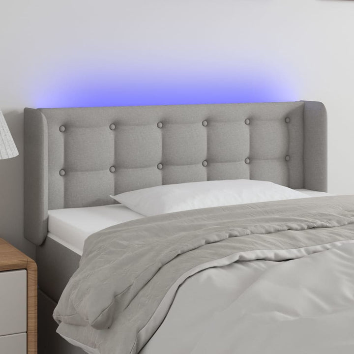 sengegavl med LED-lys 103x16x78/88 cm stof lysegrå