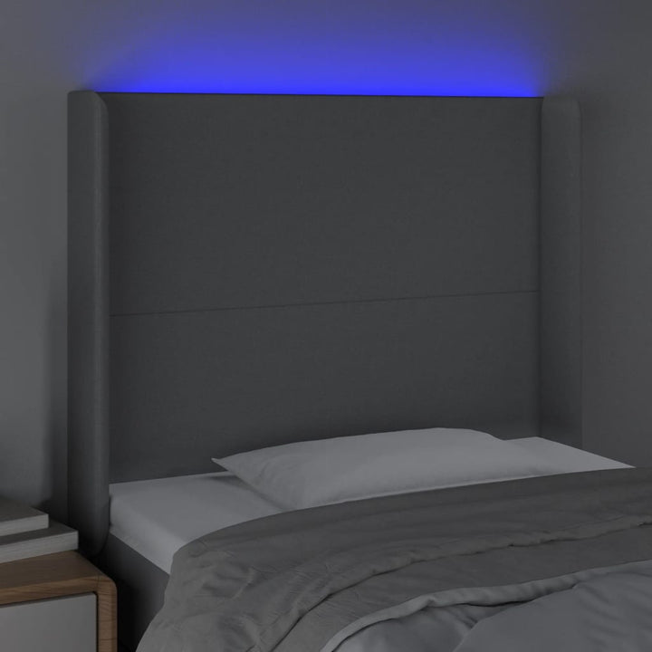 sengegavl med LED-lys 103x16x118/128 cm stof lysegrå