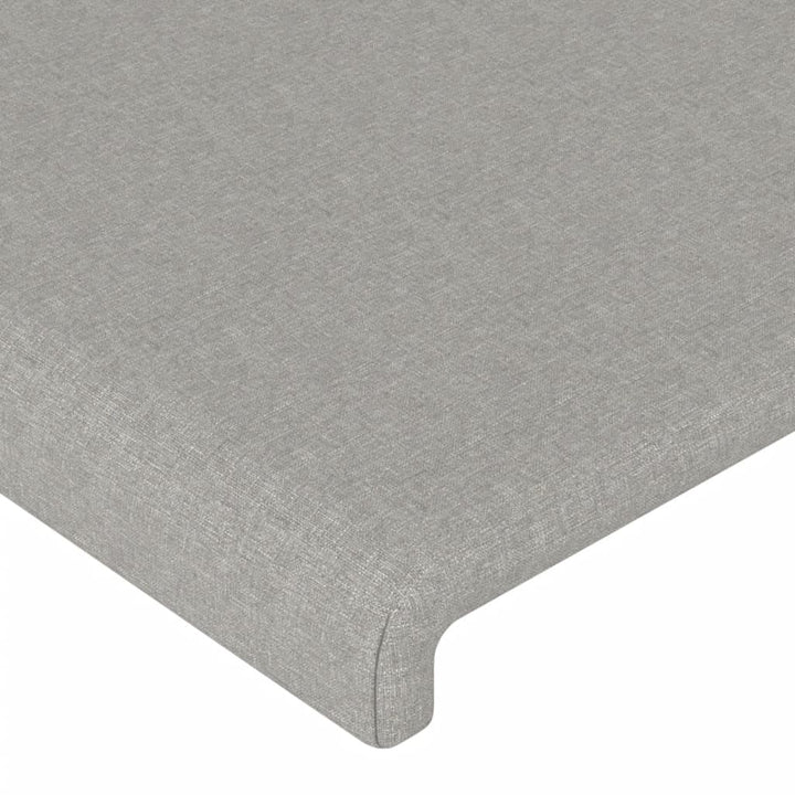 sengegavl med LED-lys 163x16x118/128 cm stof lysegrå