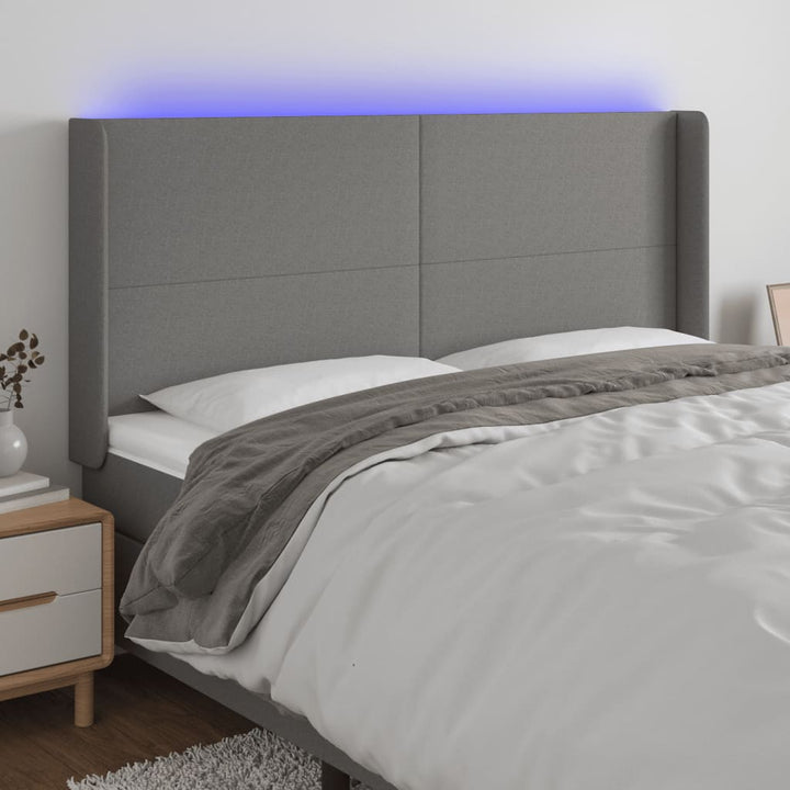 sengegavl med LED-lys 163x16x118/128 cm stof mørkegrå