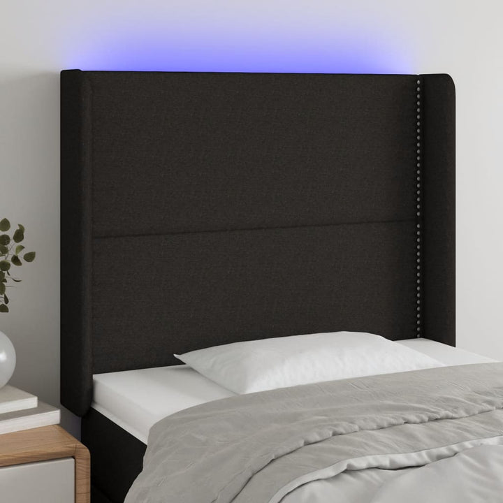 sengegavl med LED-lys 103x16x118/128 cm stof sort