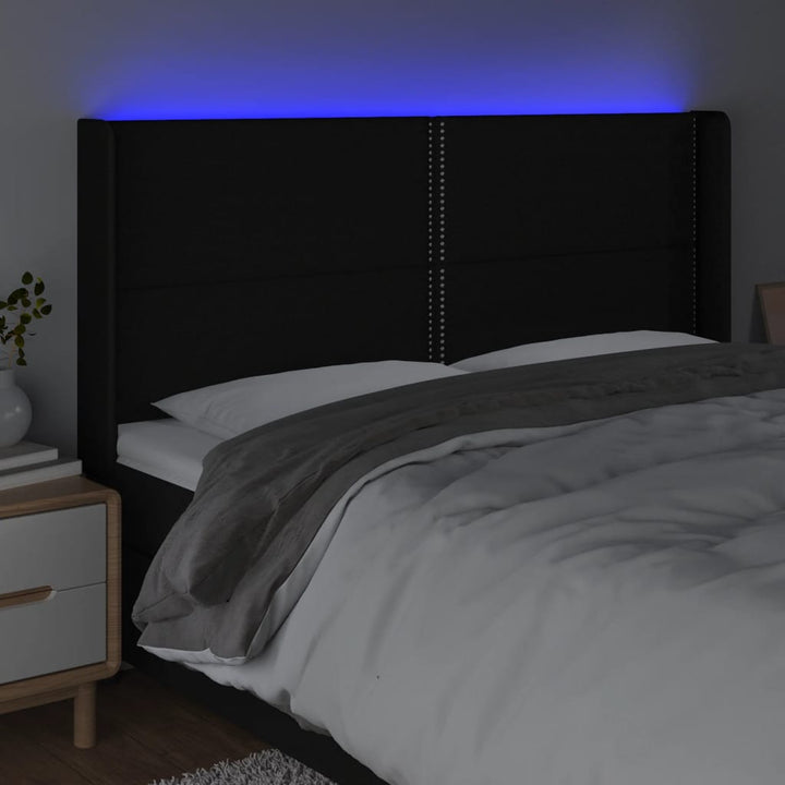 sengegavl med LED-lys 163x16x118/128 cm stof sort