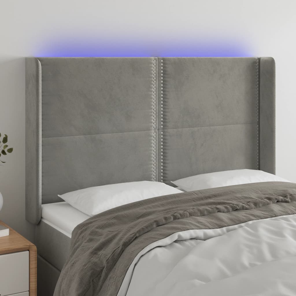 sengegavl med LED-lys 147x16x118/128 cm fløjl lysegrå