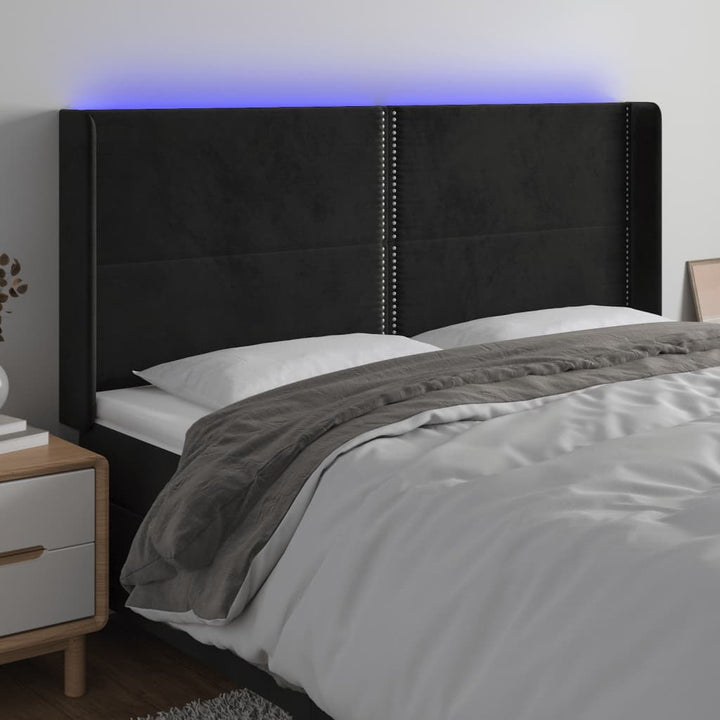sengegavl med LED-lys 163x16x118/128 cm fløjl sort