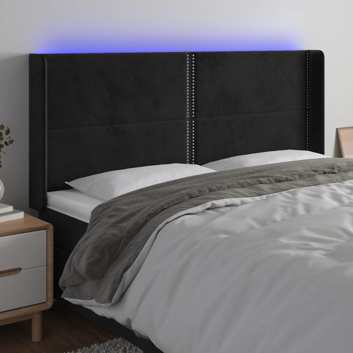 sengegavl med LED-lys 203x16x118/128 cm fløjl sort