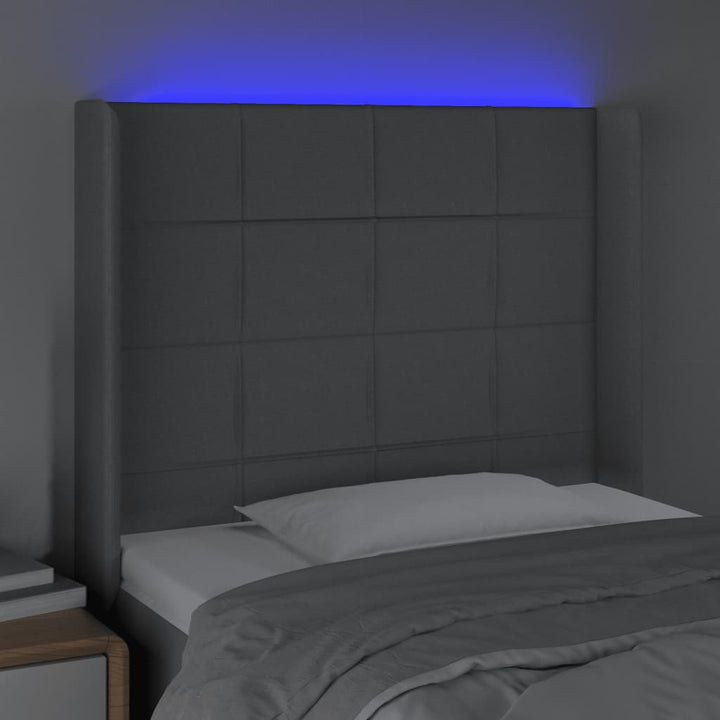 sengegavl med LED-lys 83x16x118/128 cm stof lysegrå