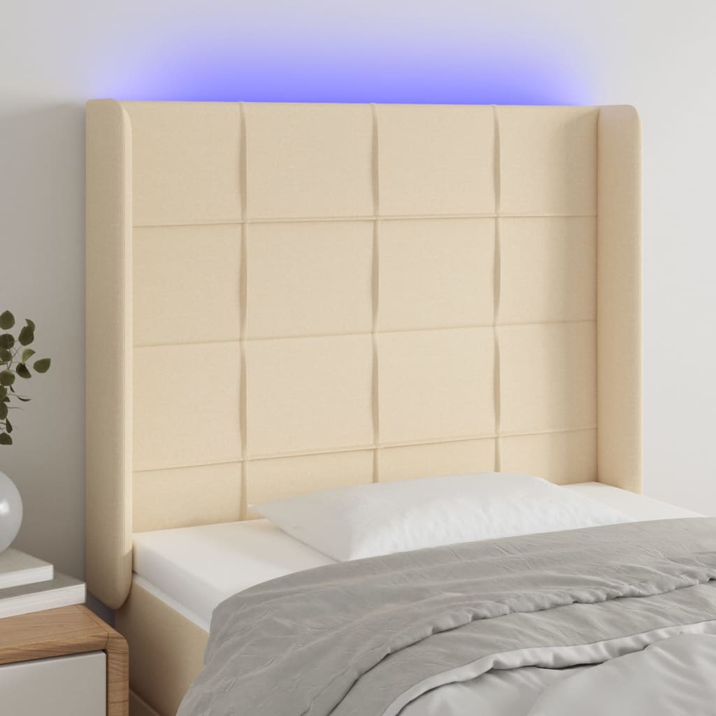 sengegavl med LED-lys 93x16x118/128 cm stof cremefarvet