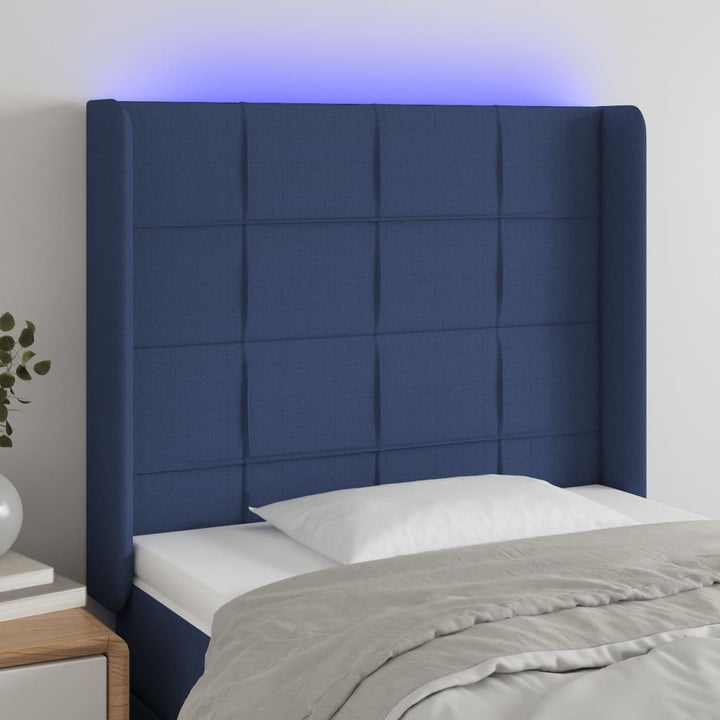 sengegavl med LED-lys 103x16x118/128 cm stof blå
