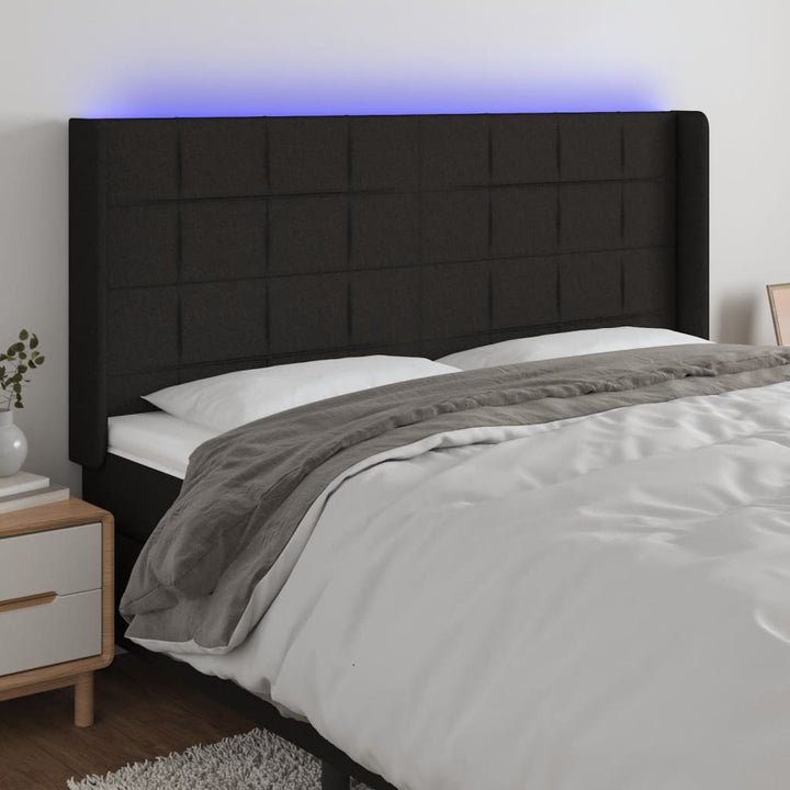 sengegavl med LED-lys 163x16x118/128 cm stof sort