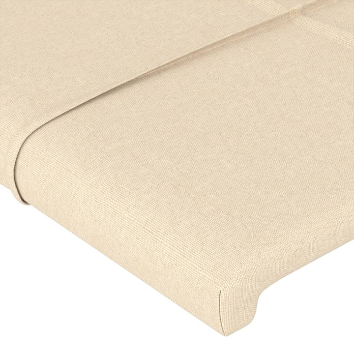 sengegavl med LED-lys 163x16x118/128 cm stof cremefarvet