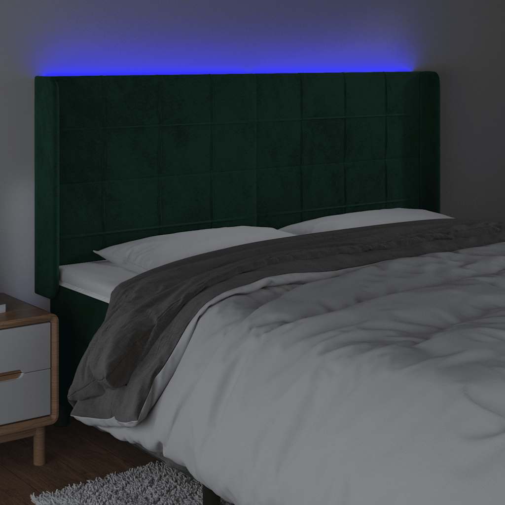 sengegavl med LED-lys 183x16x118/128 cm fløjl mørkegrøn
