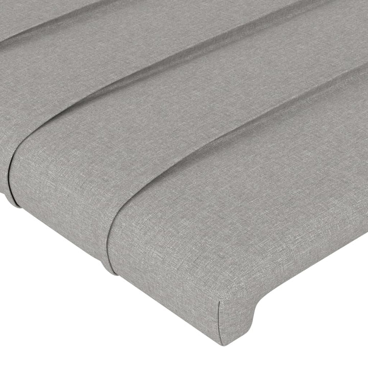 sengegavl med LED-lys 83x16x118/128 cm stof lysegrå