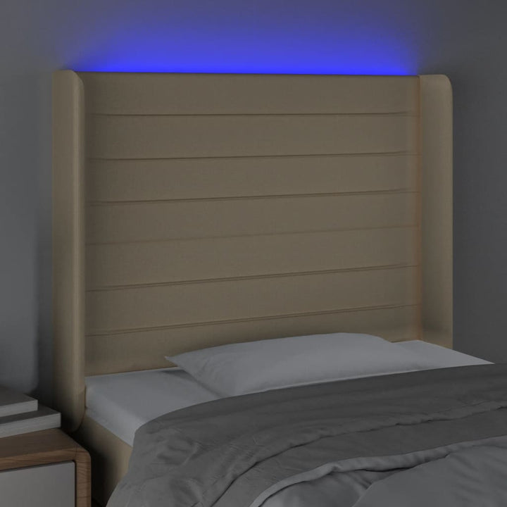 sengegavl med LED-lys 83x16x118/128 cm stof cremefarvet