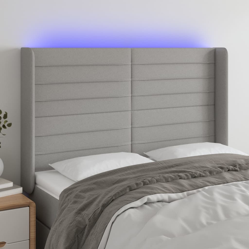 sengegavl med LED-lys 147x16x118/128 cm stof lysegrå