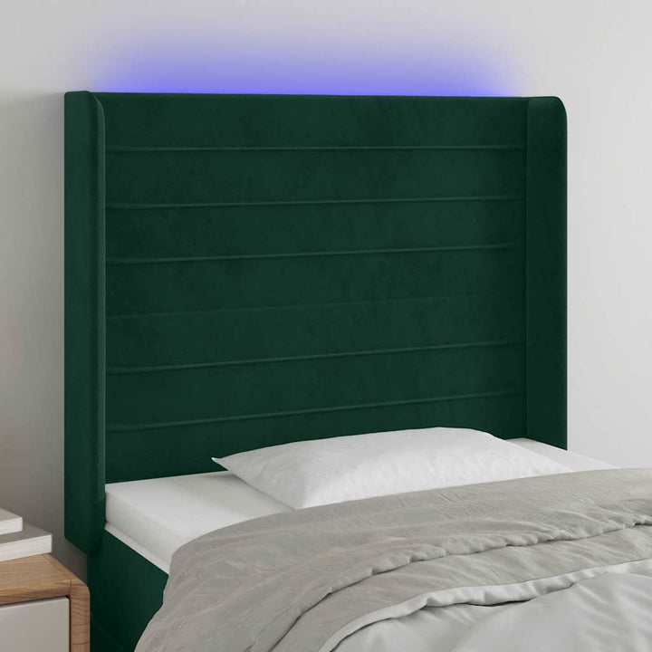 sengegavl med LED-lys 93x16x118/128 cm fløjl mørkegrøn