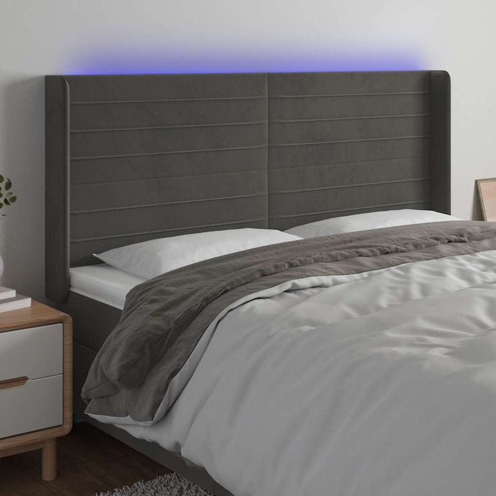 sengegavl med LED-lys 163x16x118/128 cm fløjl mørkegrå