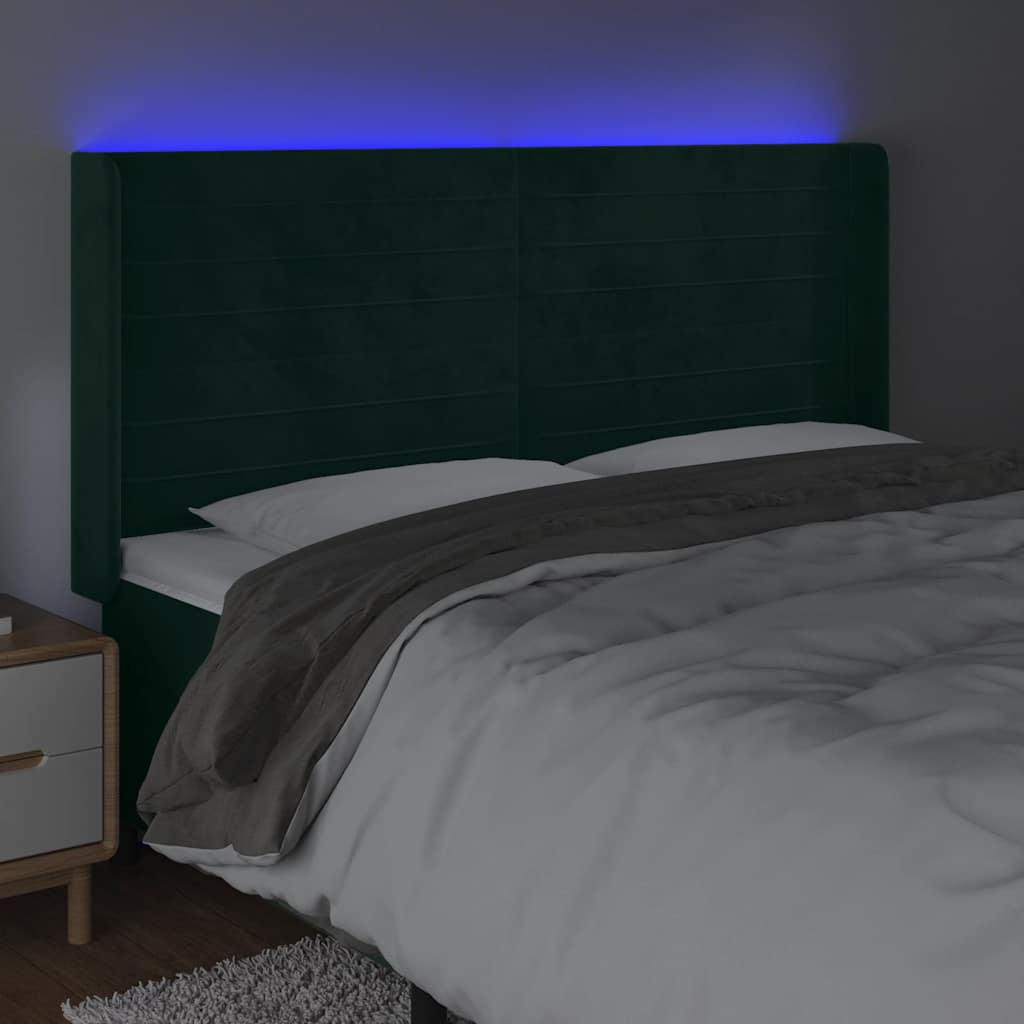 sengegavl med LED-lys 183x16x118/128 cm fløjl mørkegrøn