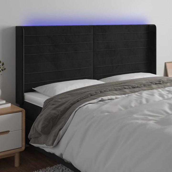 sengegavl med LED-lys 203x16x118/128 cm fløjl sort