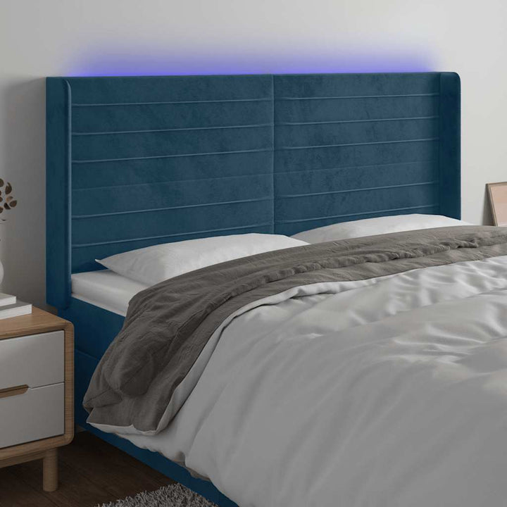 sengegavl med LED-lys 203x16x118/128 cm fløjl mørkeblå