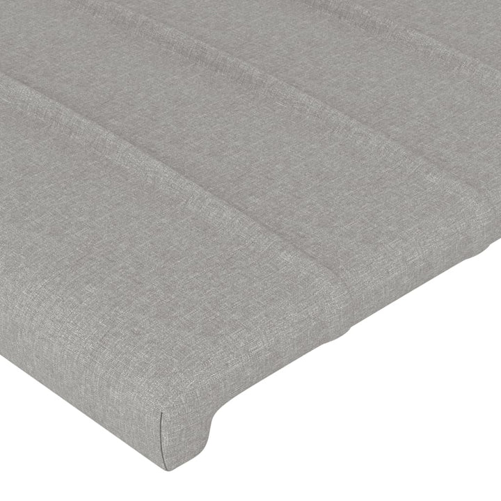 sengegavl med LED-lys 93x16x118/128 cm stof lysegrå