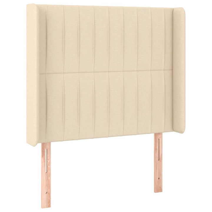 sengegavl med LED-lys 93x16x118/128 cm stof cremefarvet