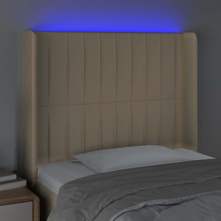 sengegavl med LED-lys 93x16x118/128 cm stof cremefarvet