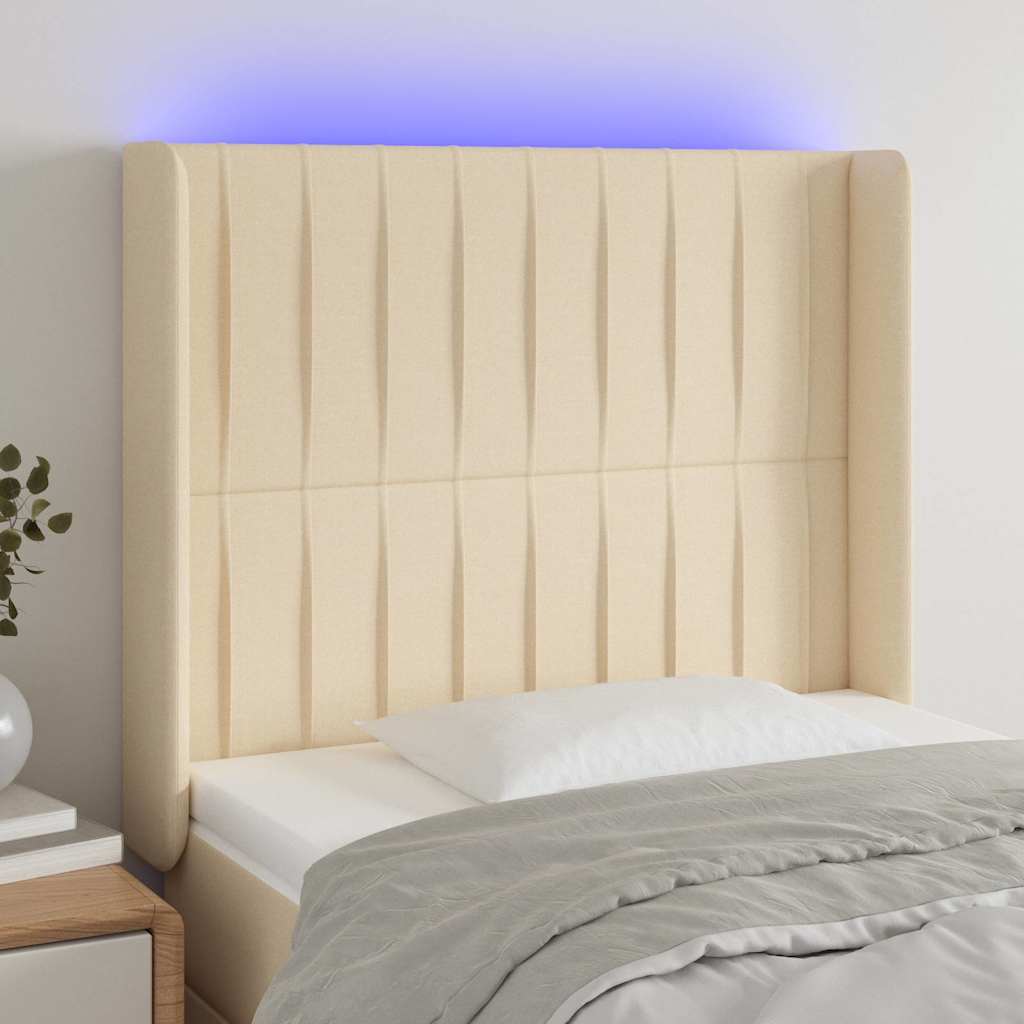 sengegavl med LED-lys 93x16x118/128 cm stof cremefarvet