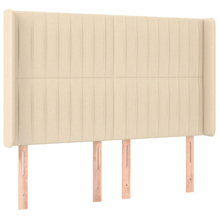 sengegavl med LED-lys 147x16x118/128 cm stof cremefarvet