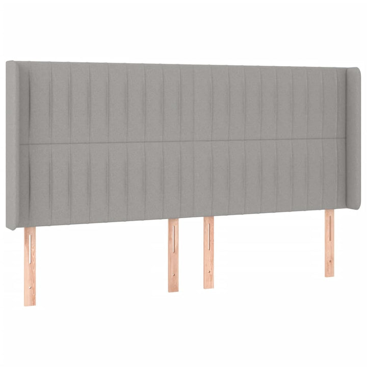 sengegavl med LED-lys 163x16x118/128 cm stof lysegrå