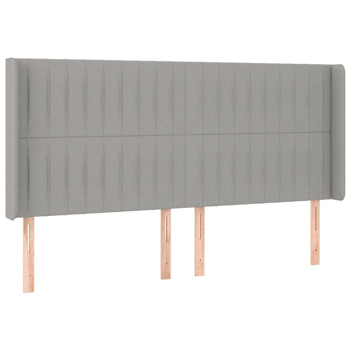 sengegavl med LED-lys 183x16x118/128 cm stof lysegrå