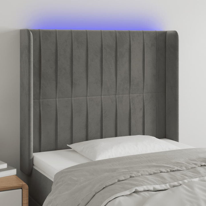 sengegavl med LED-lys 83x16x118/128 cm fløjl lysegrå