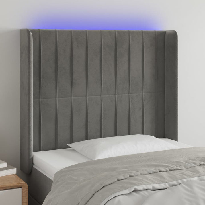 sengegavl med LED-lys 93x16x118/128 cm fløjl lysegrå