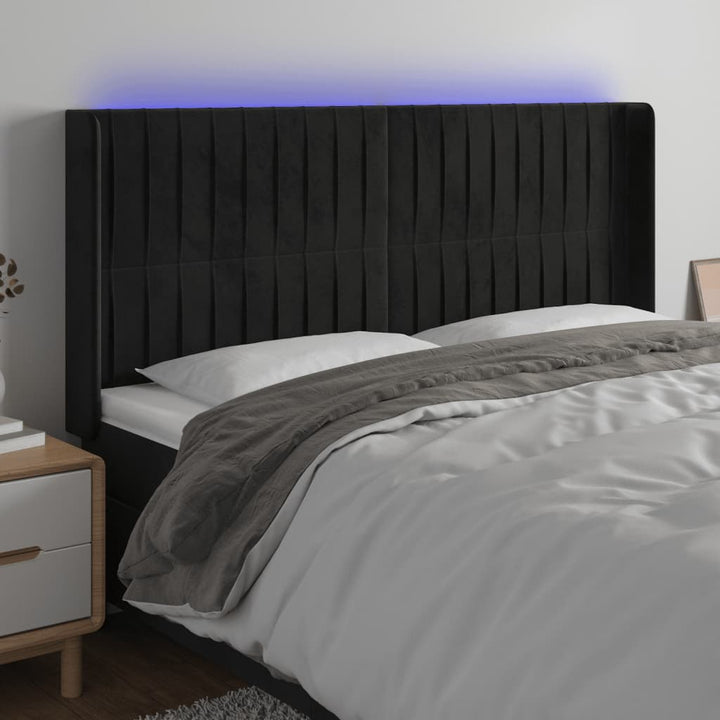sengegavl med LED-lys 163x16x118/128 cm fløjl sort