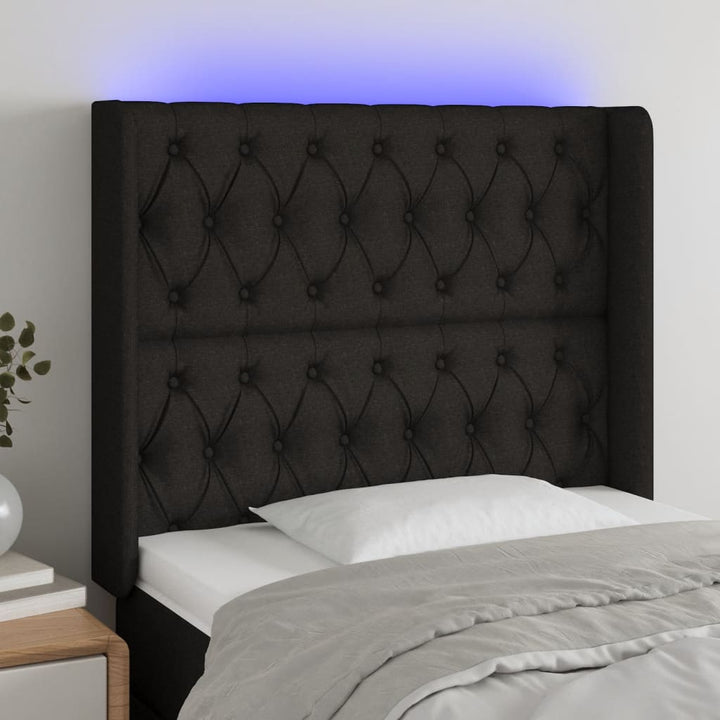 sengegavl med LED-lys 103x16x118/128 cm stof sort