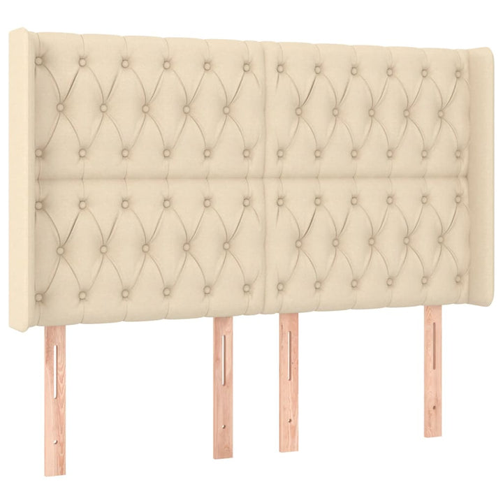 sengegavl med LED-lys 147x16x118/128 cm stof cremefarvet