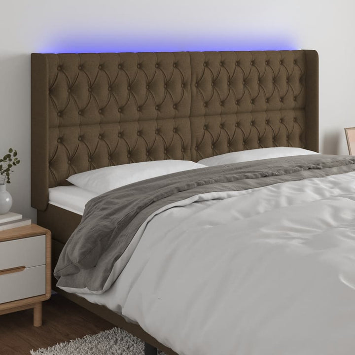 sengegavl med LED-lys 203x16x118/128 cm stof mørkebrun
