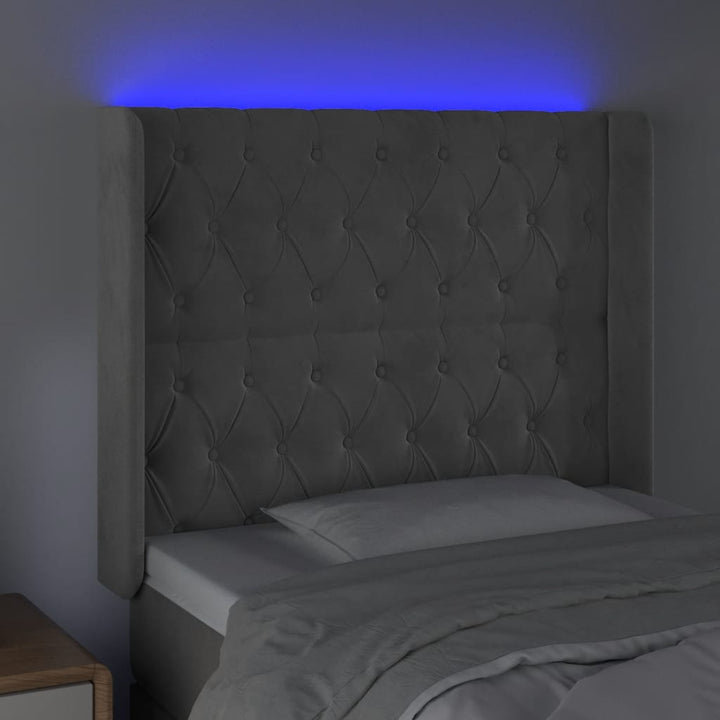 sengegavl med LED-lys 103x16x118/128 cm fløjl lysegrå