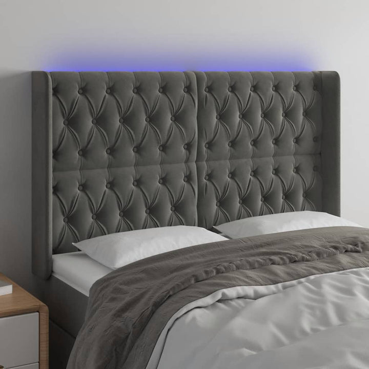 sengegavl med LED-lys 147x16x118/128 cm fløjl mørkegrå