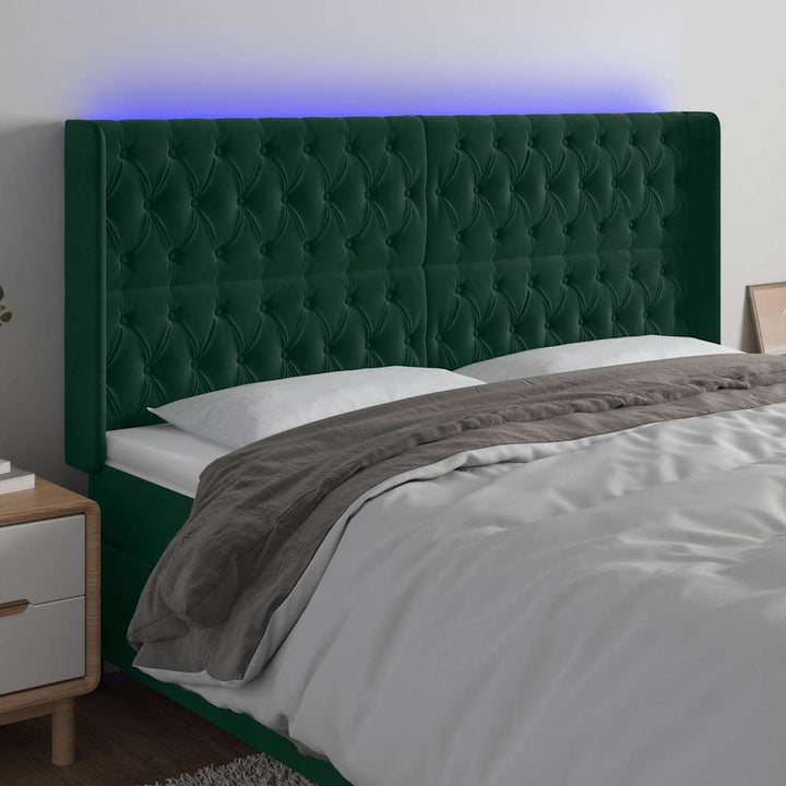 sengegavl med LED-lys 203x16x118/128 cm fløjl mørkegrøn