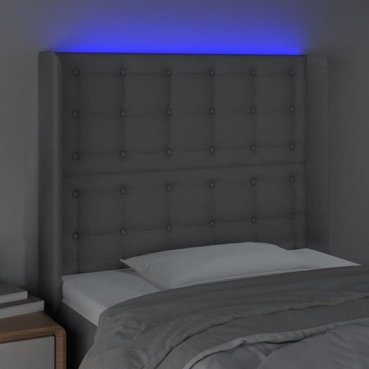 sengegavl med LED-lys 83x16x118/128 cm stof lysegrå