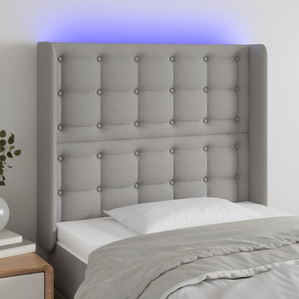 sengegavl med LED-lys 83x16x118/128 cm stof lysegrå