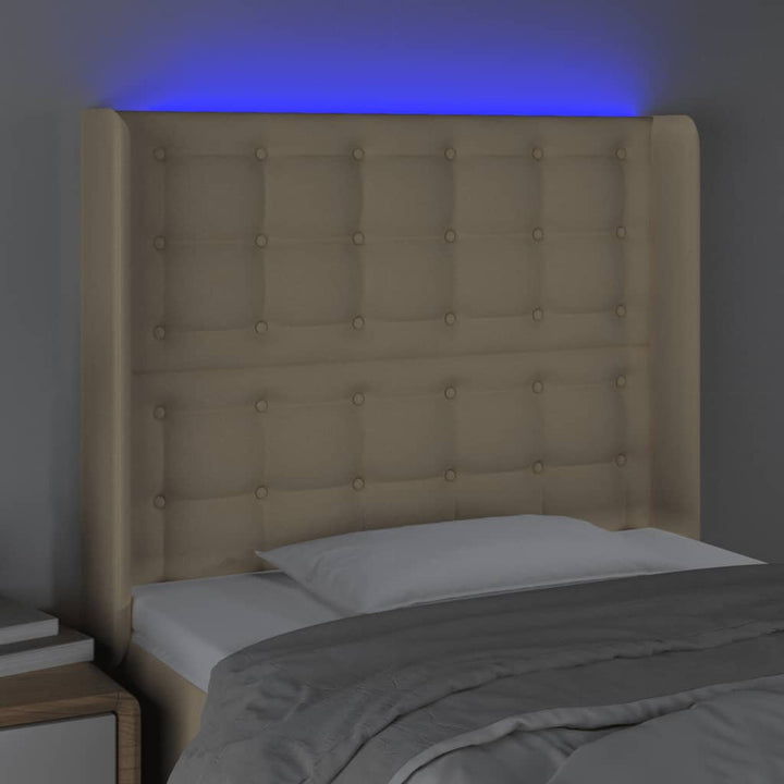 sengegavl med LED-lys 83x16x118/128 cm stof cremefarvet