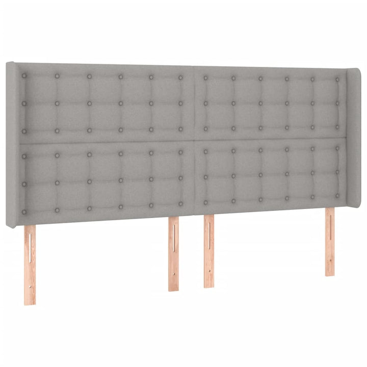 sengegavl med LED-lys 203x16x118/128 cm stof lysegrå