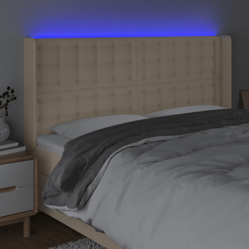sengegavl med LED-lys 203x16x118/128 cm stof cremefarvet