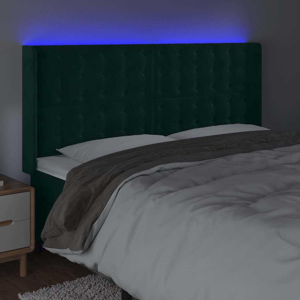 sengegavl med LED-lys 163x16x118/128 cm fløjl mørkegrøn